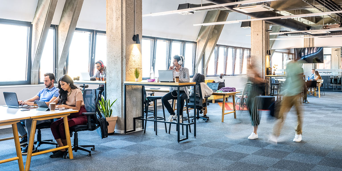 Business people working in commercial building shared office space