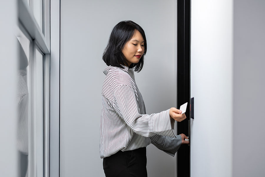 employee badging into office at access control reader