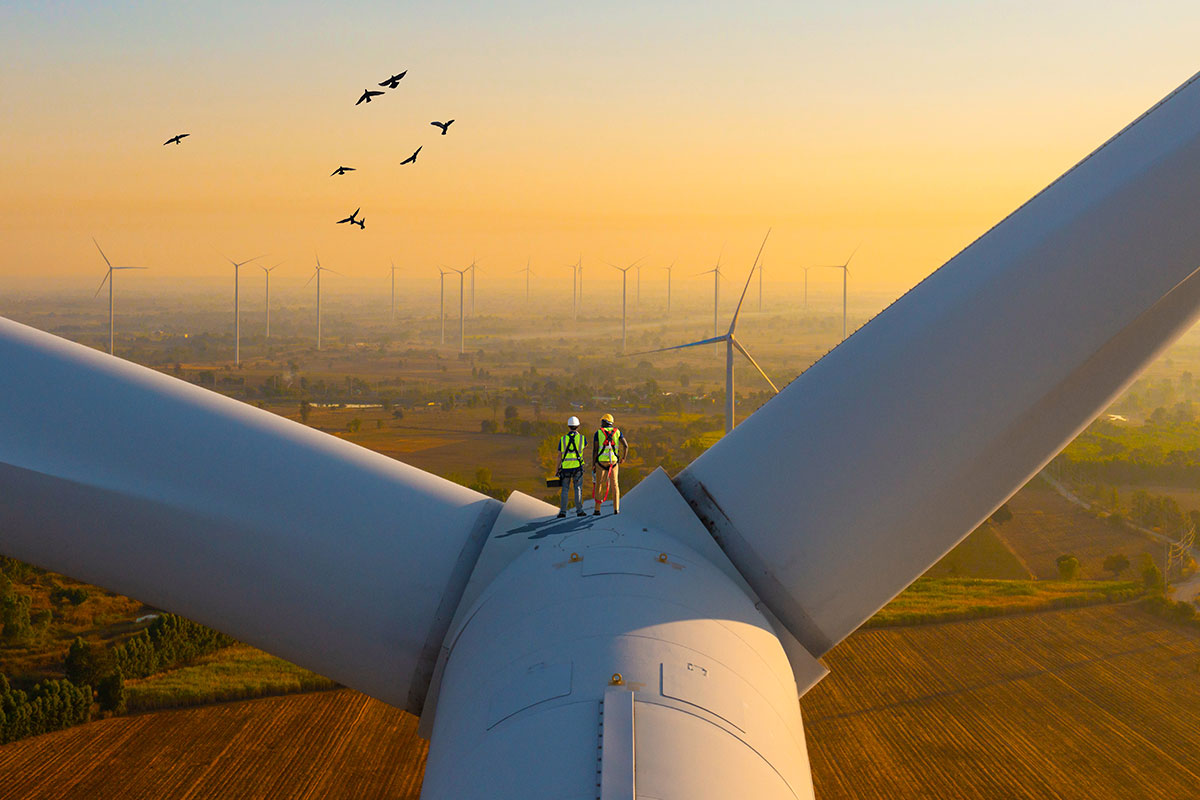 Two access technicians working on wind turbine