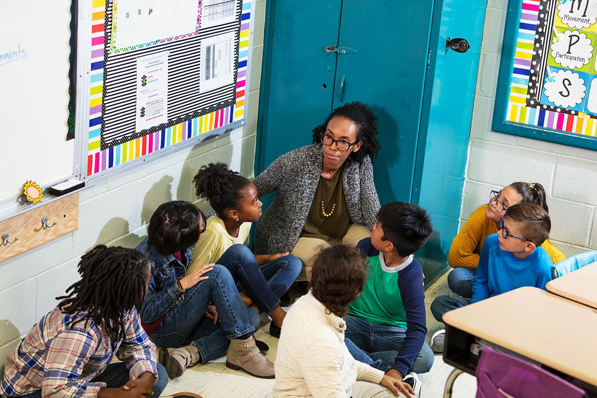 Teacher and children doing school safety drill, lockdown